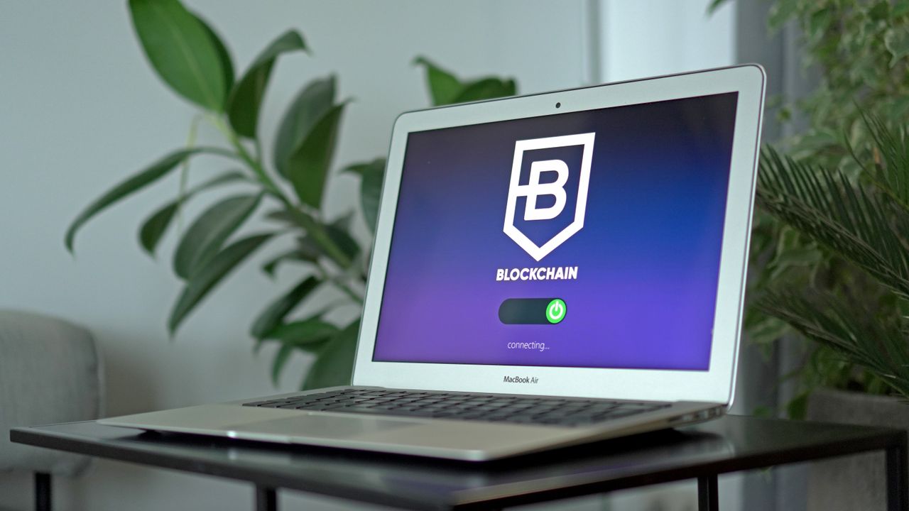 Mastering the First Impression: Your intriguing post title goes here A sleek laptop showing a blockchain interface on a desk, ideal for technology and finance themes.